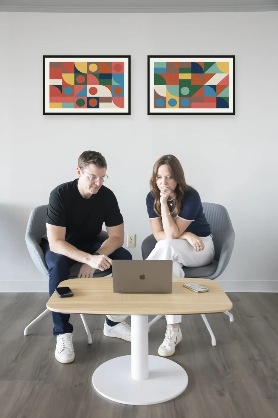 Michael Newsome and Cara Geissler reviewing a client site in the LAB office